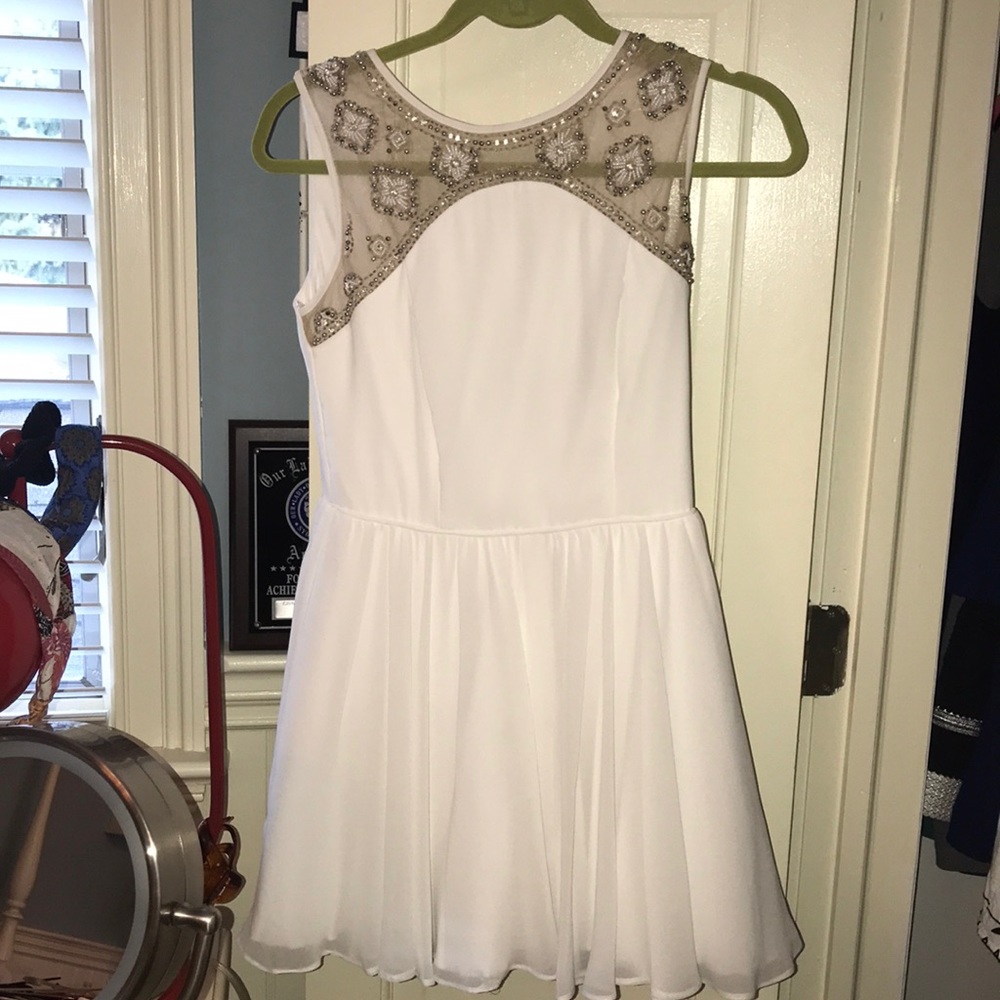 White dress with beading on top